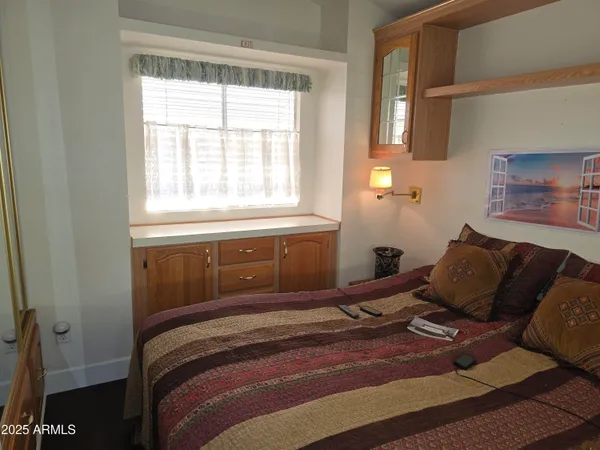 a bedroom with a bed and window