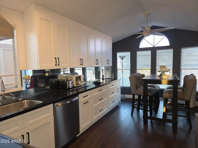 a kitchen with lots of counter top space and dining table