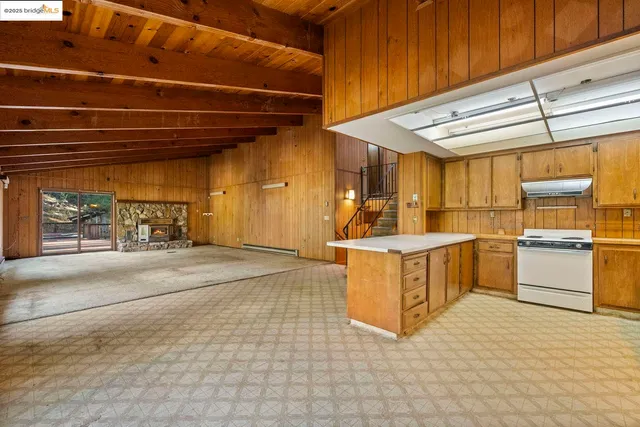 a view of a kitchen with appliances and cabinets