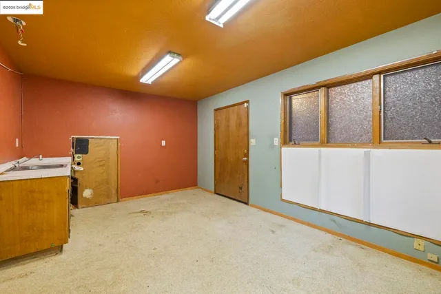 a view of a livingroom with a kitchen