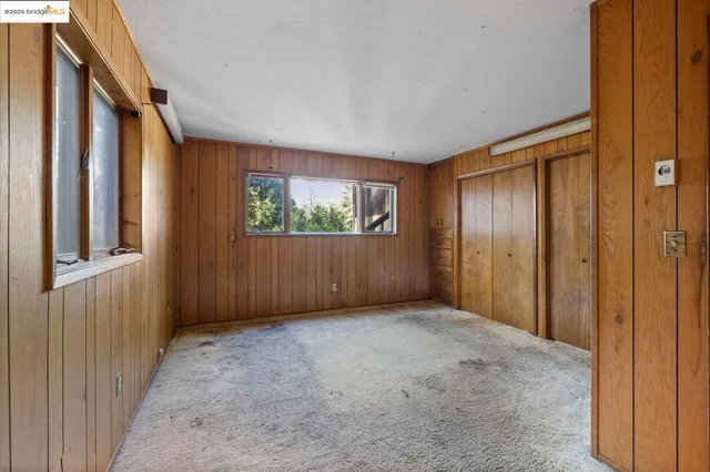 an empty room with windows