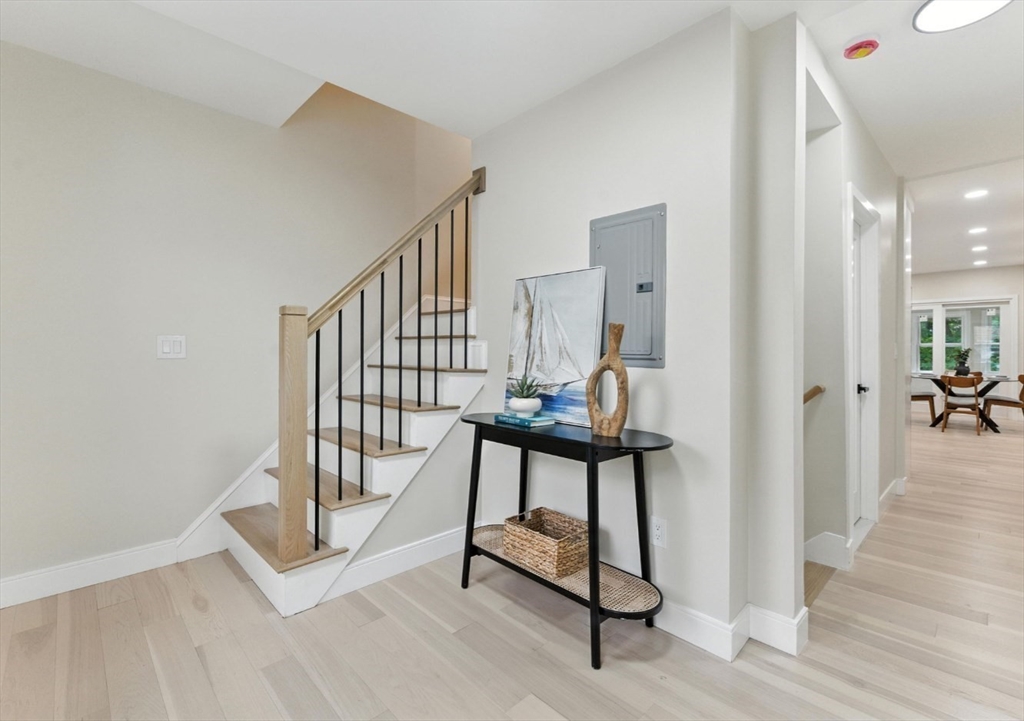 76 Orchard Street, Unit 76 Medford, MA 02155 - Photo 12 of 21 a view of entryway with wooden floor and stairs