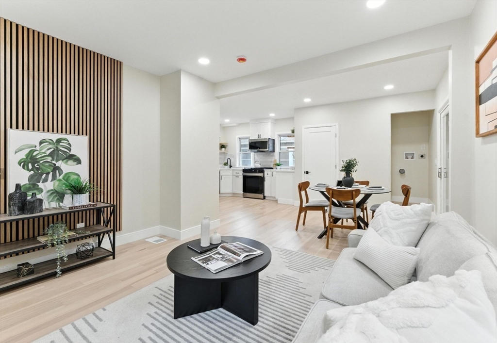 76 Orchard Street, Unit 76 Medford, MA 02155 - Photo 3 of 21 a living room with furniture and a wooden floor