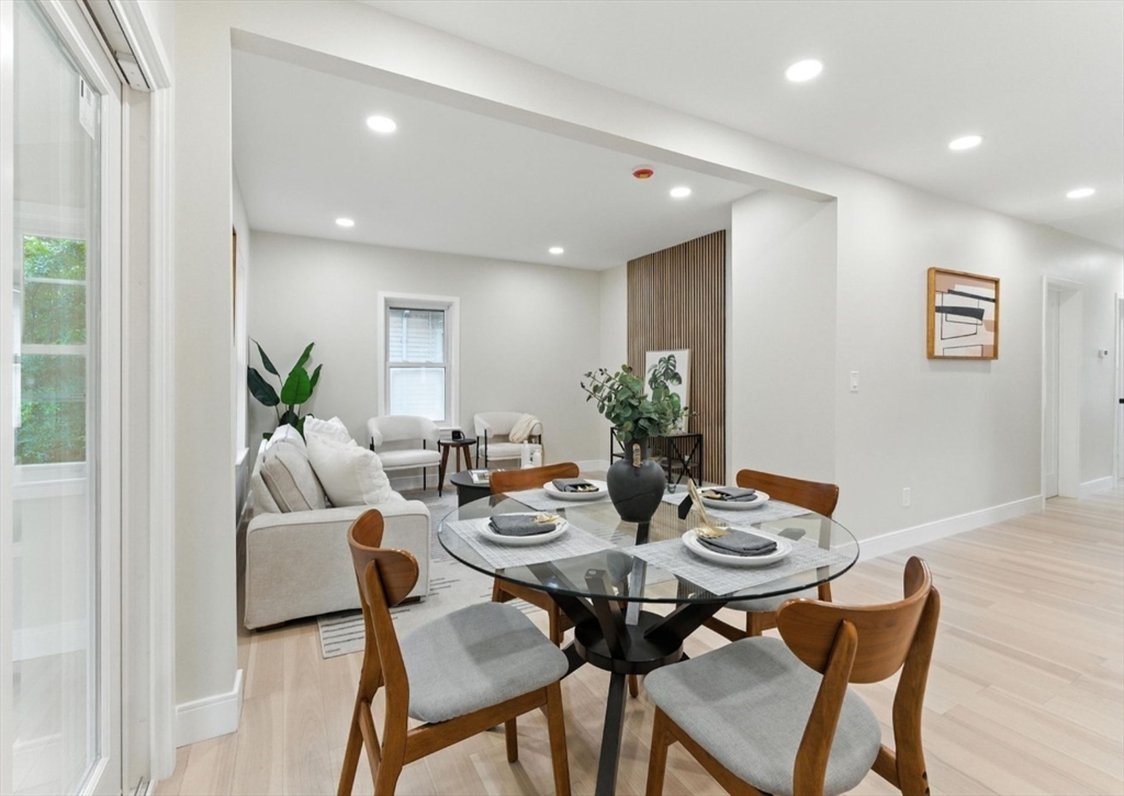 76 Orchard Street, Unit 76 Medford, MA 02155 - Photo 4 of 21 a view of a dining room with furniture and wooden floor