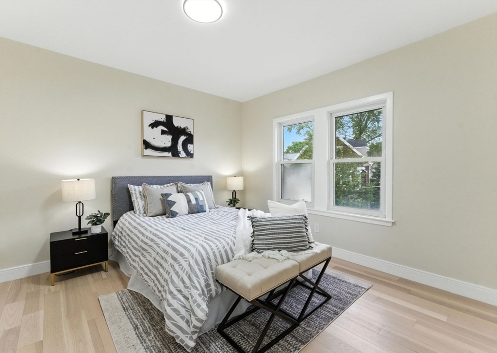 76 Orchard Street, Unit 76 Medford, MA 02155 - Photo 9 of 21 a bedroom with a bed and a window