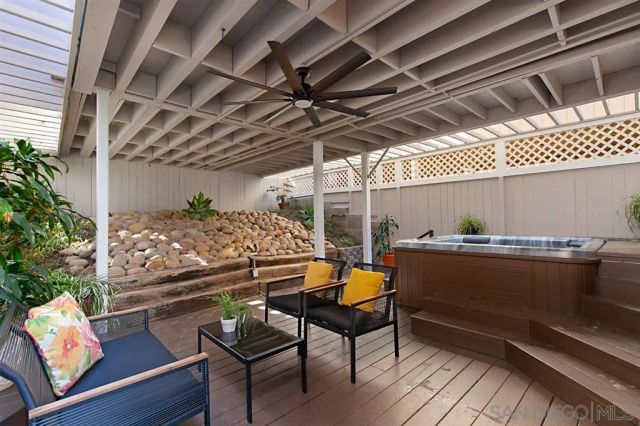 a kitchen with a sink and wooden floor