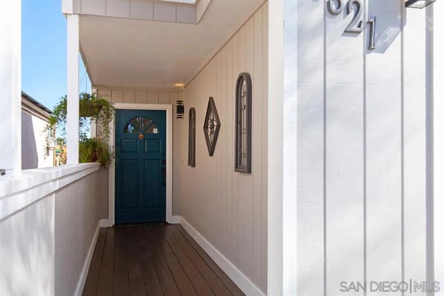 a living room with fireplace furniture and a large window
