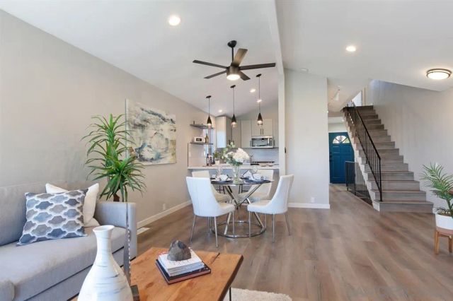 a dining room with furniture and window