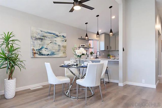 a kitchen with stainless steel appliances kitchen island granite countertop a sink and cabinets