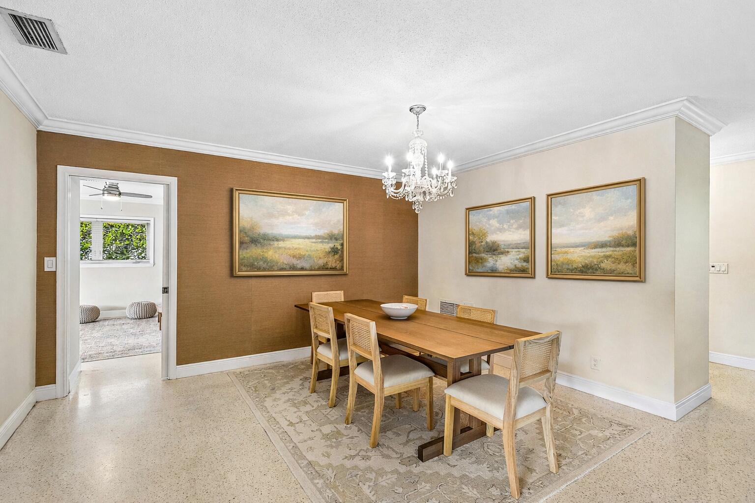 670 Elm Tree Lane Boca Raton, FL 33486 - Photo 16 of 44 a view of a dining room with furniture and chandelier