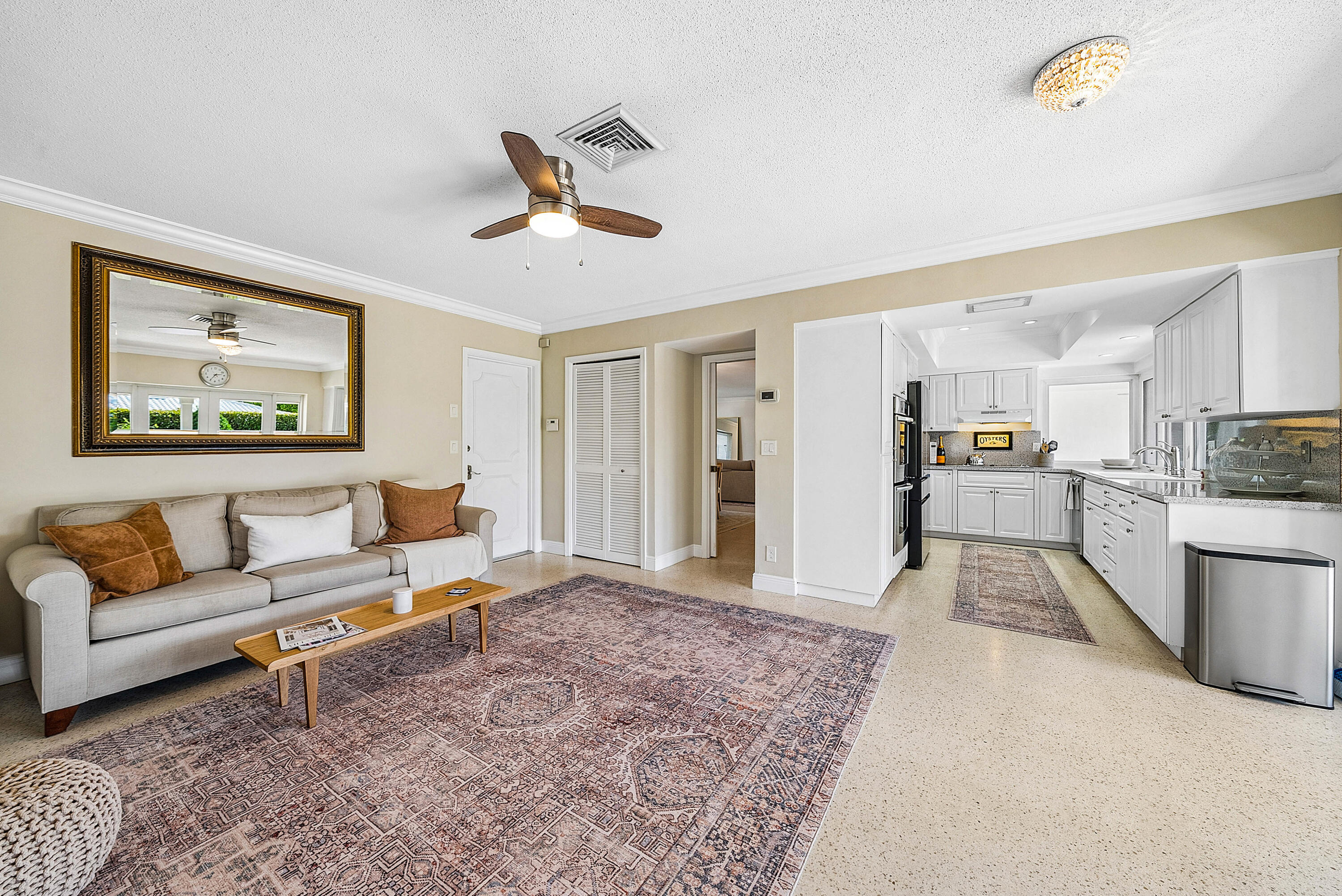 670 Elm Tree Lane Boca Raton, FL 33486 - Photo 18 of 44 a living room with furniture and kitchen view