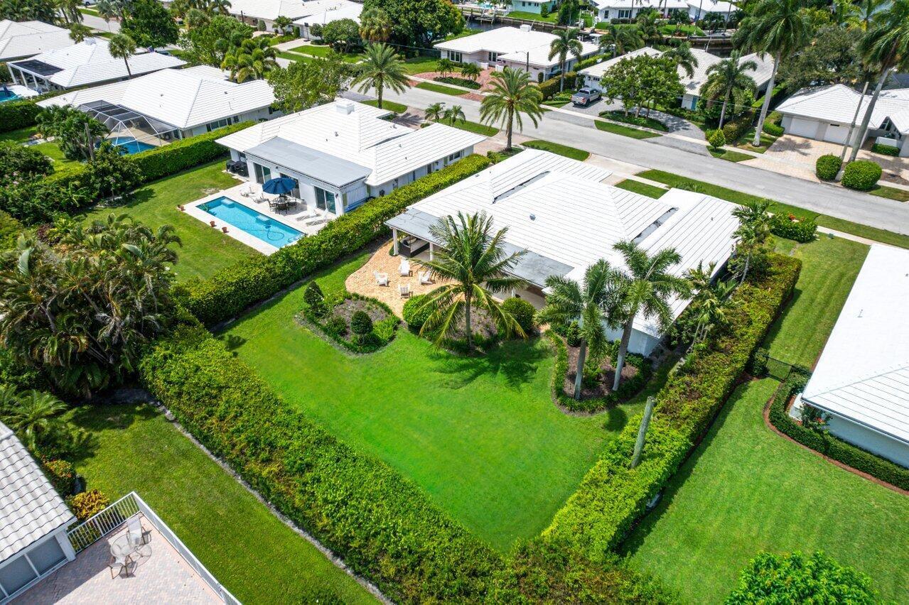 670 Elm Tree Lane Boca Raton, FL 33486 - Photo 2 of 44 an aerial view of residential houses with outdoor space and trees