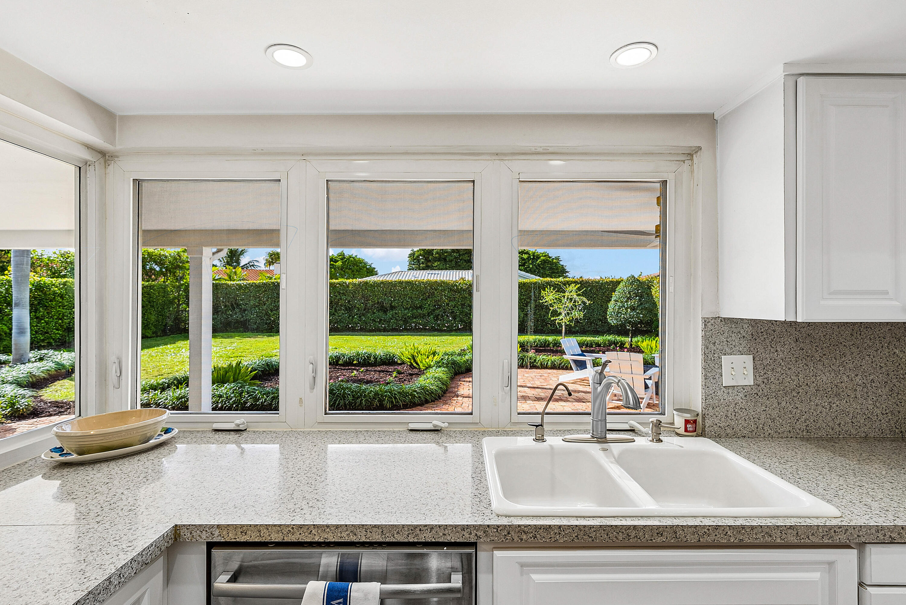 670 Elm Tree Lane Boca Raton, FL 33486 - Photo 22 of 44 a kitchen with a sink and large window