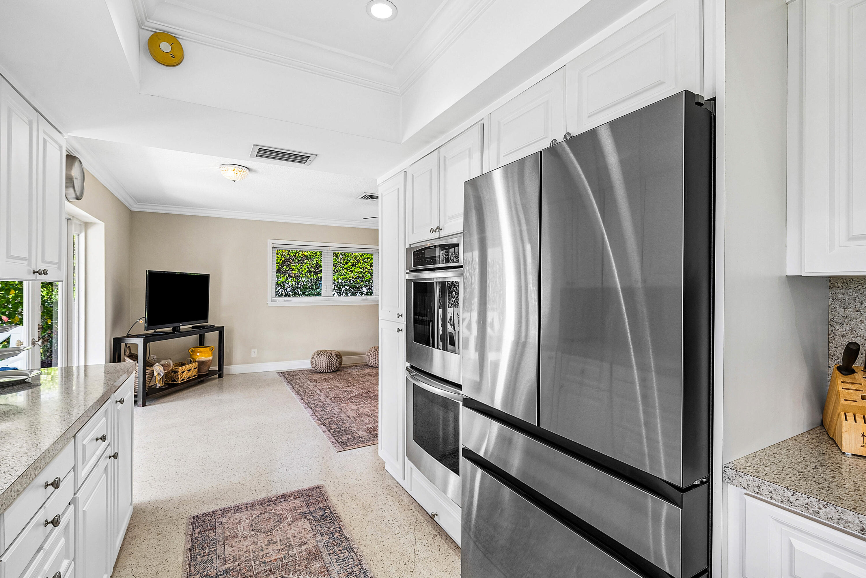 670 Elm Tree Lane Boca Raton, FL 33486 - Photo 24 of 44 a kitchen with stainless steel appliances a refrigerator and a stove