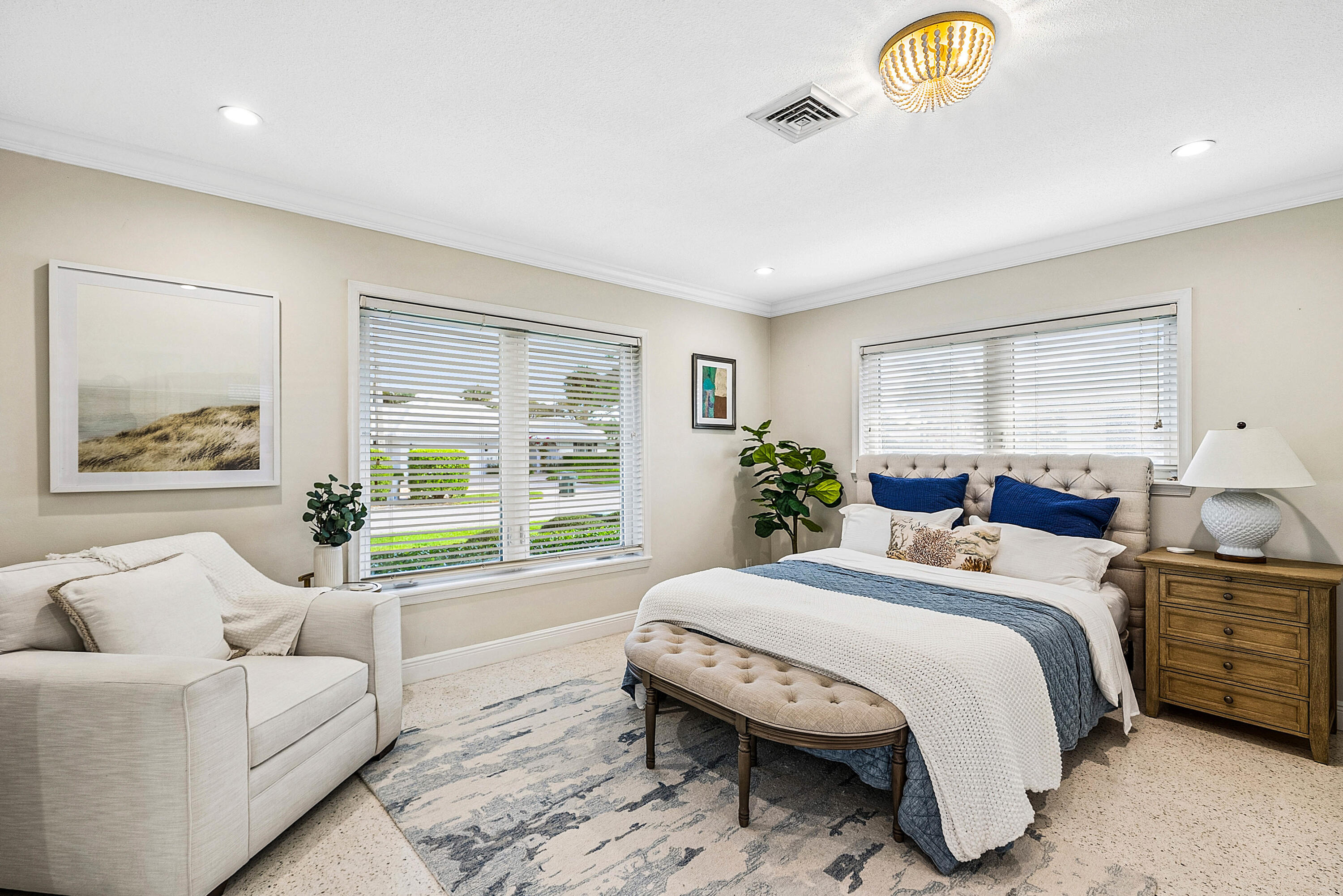 670 Elm Tree Lane Boca Raton, FL 33486 - Photo 25 of 44 a bedroom with a bed and a couch