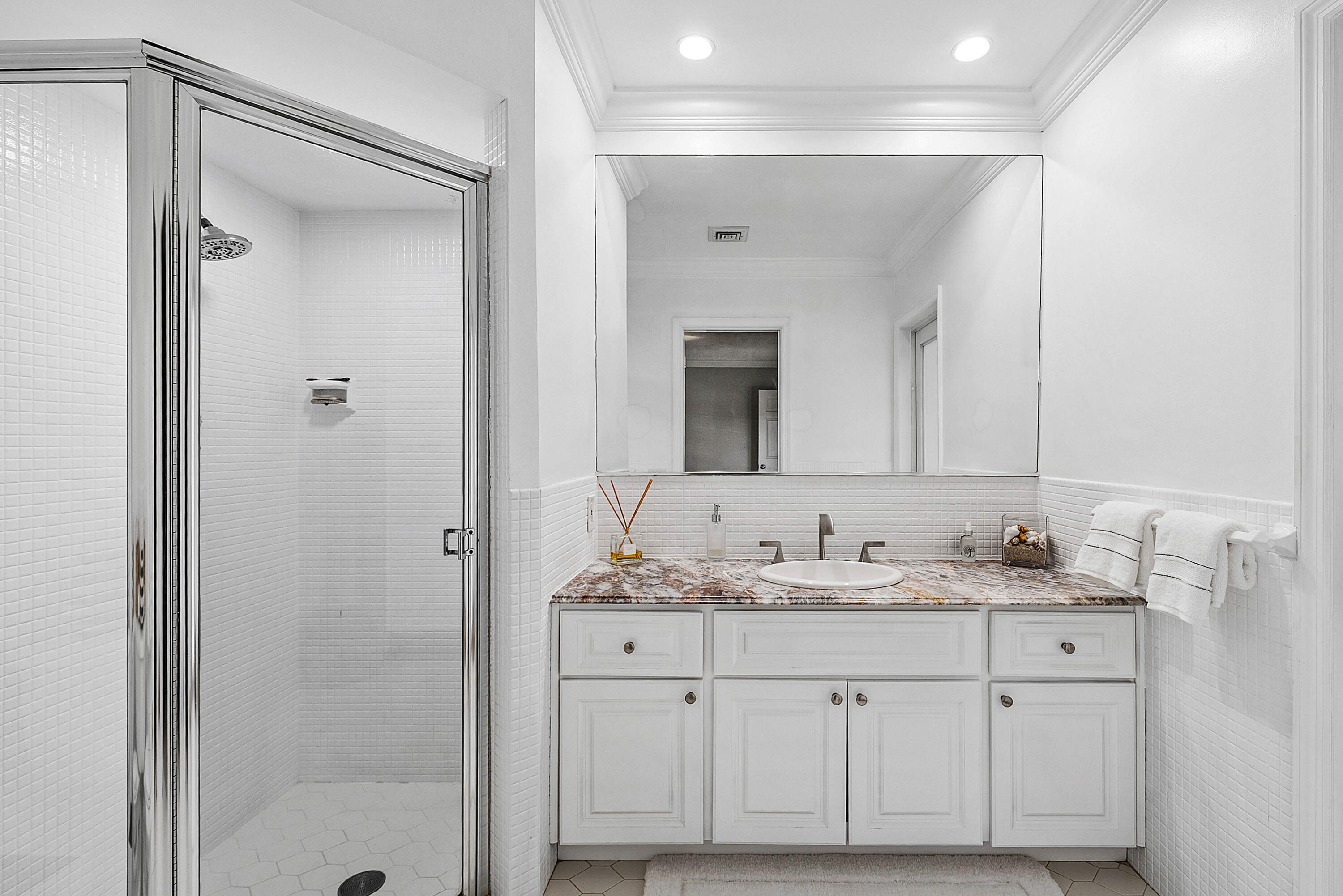 670 Elm Tree Lane Boca Raton, FL 33486 - Photo 31 of 44 a bathroom with a sink vanity granite and a mirror