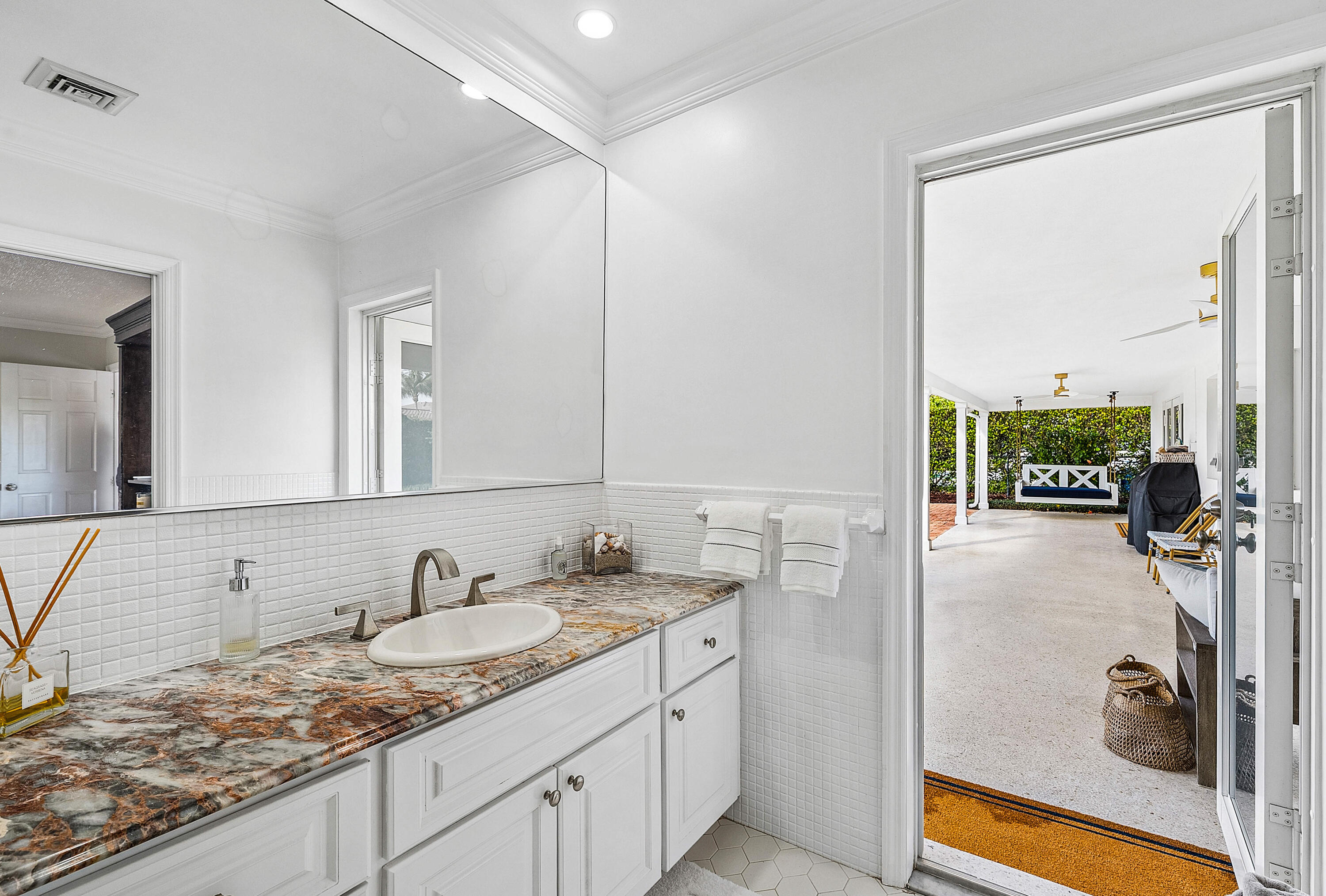 670 Elm Tree Lane Boca Raton, FL 33486 - Photo 32 of 44 a bathroom with a granite countertop sink and a mirror