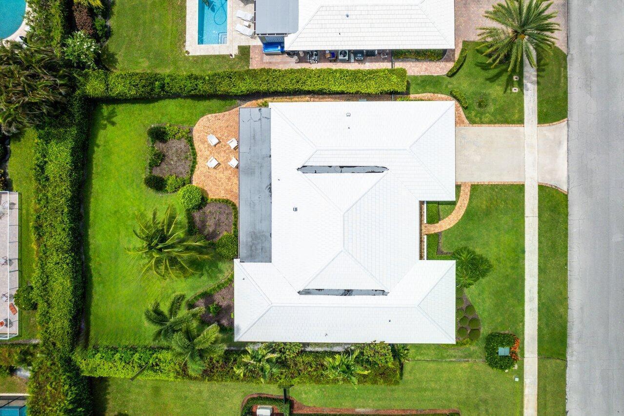 670 Elm Tree Lane Boca Raton, FL 33486 - Photo 36 of 44 an aerial view of a house with a garden and trees