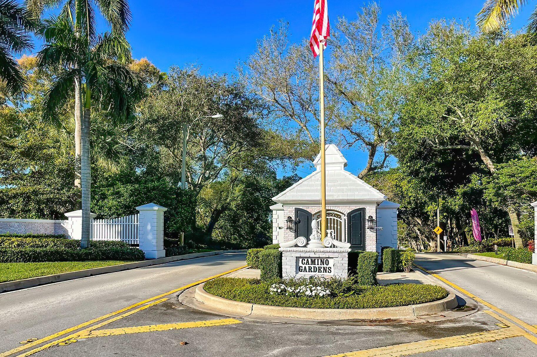 670 Elm Tree Lane Boca Raton, FL 33486 - Photo 4 of 44 a front view of house with yard and trees around