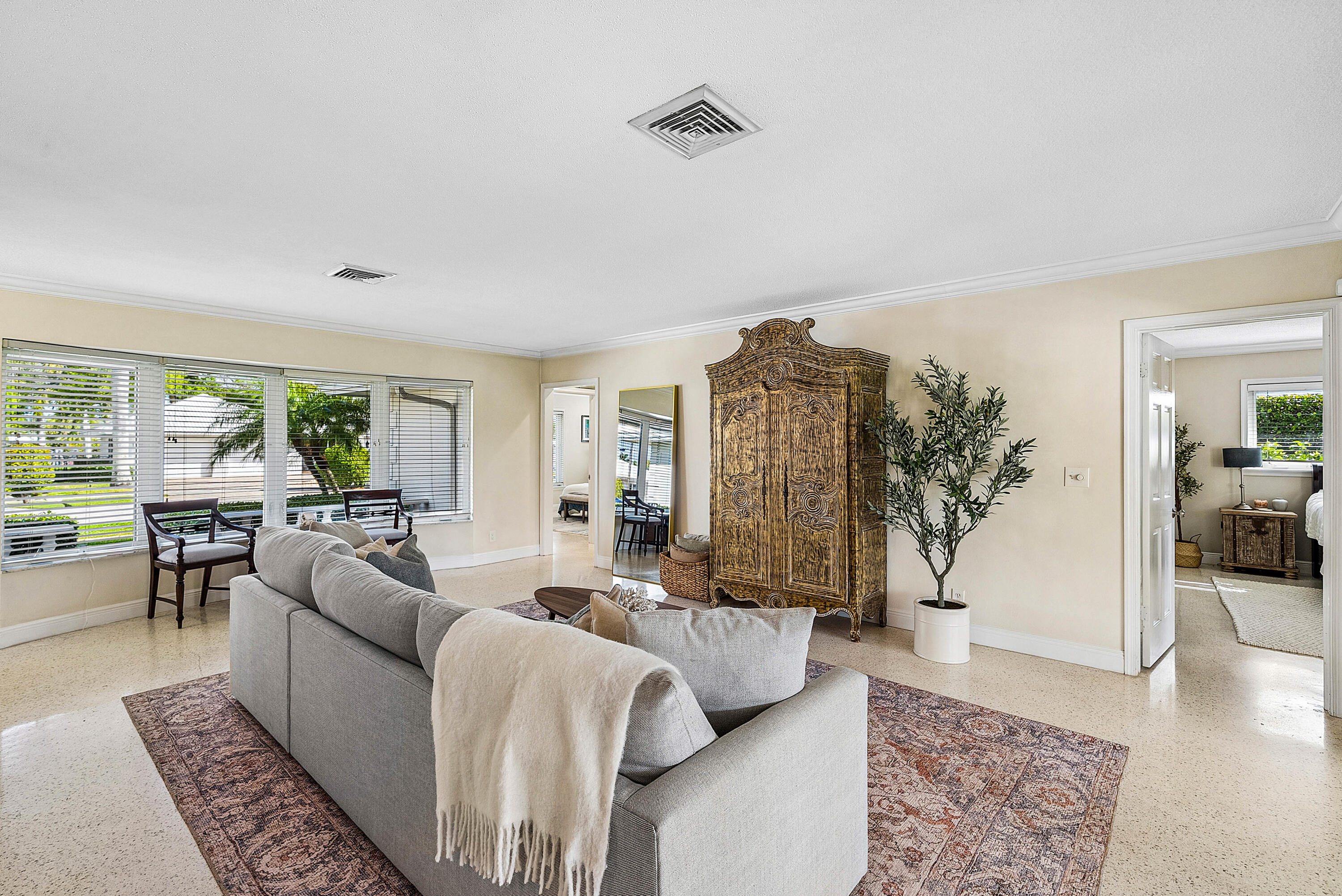 670 Elm Tree Lane Boca Raton, FL 33486 - Photo 5 of 44 a living room with furniture and a large window