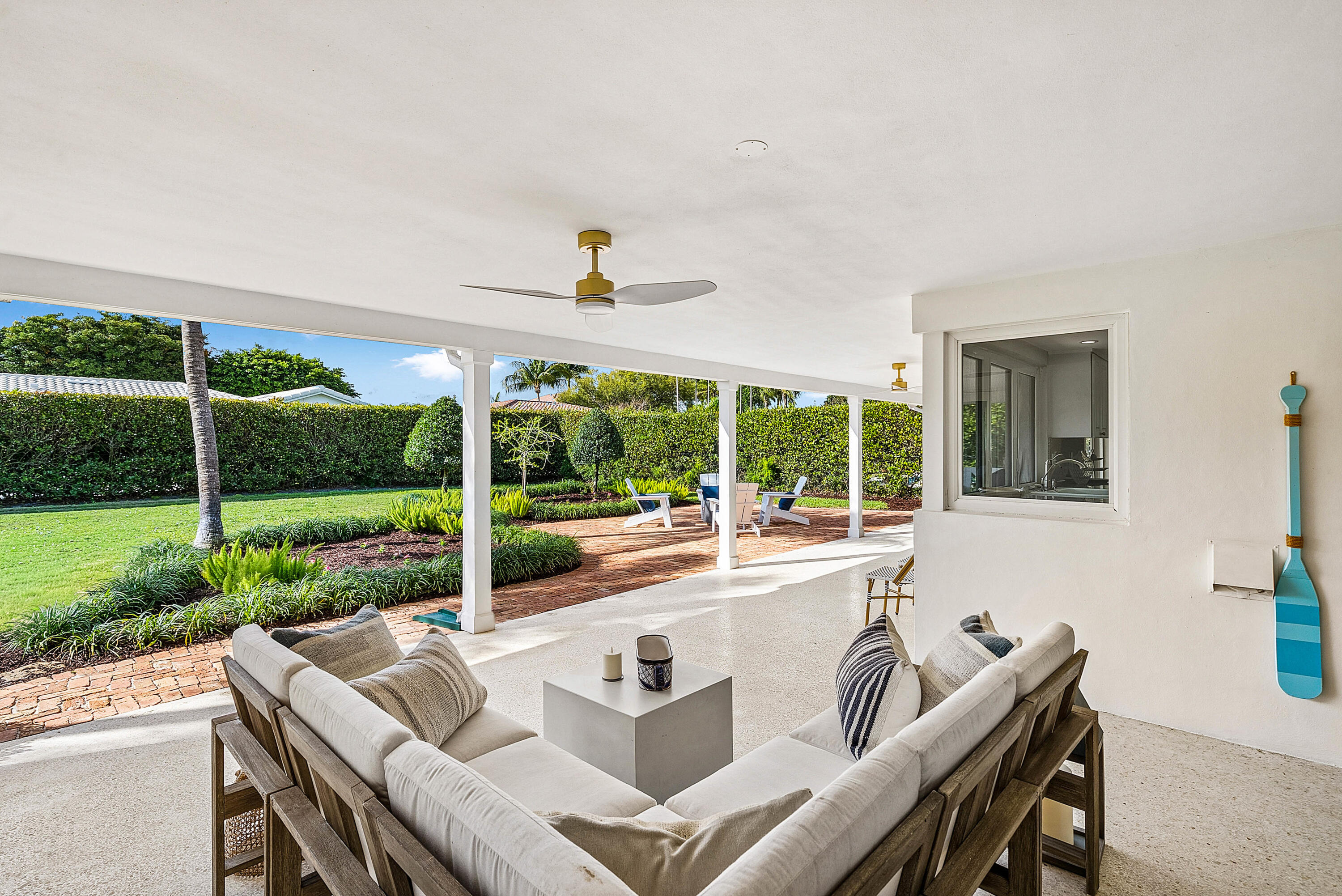670 Elm Tree Lane Boca Raton, FL 33486 - Photo 9 of 44 a view of an house with backyard porch and garden