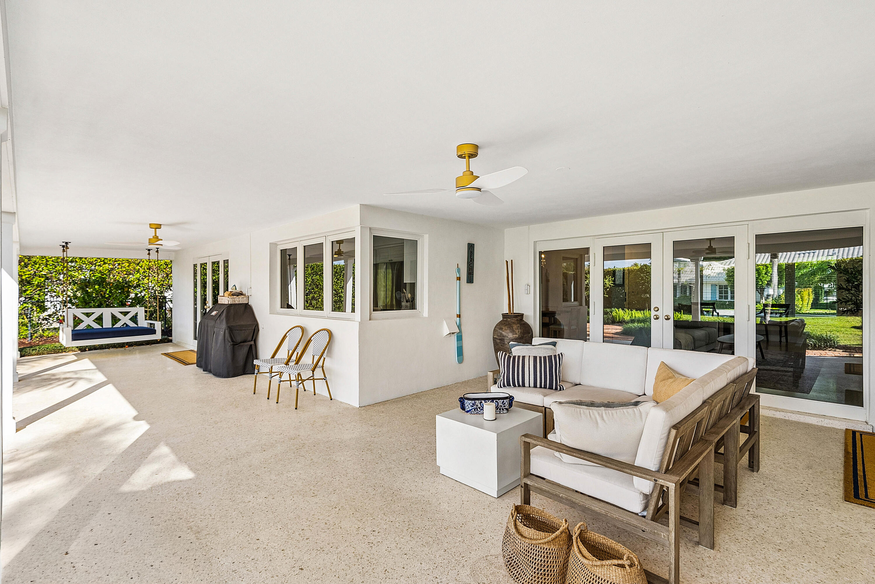 670 Elm Tree Lane Boca Raton, FL 33486 - Photo 10 of 44 a living room with furniture and a flat screen tv