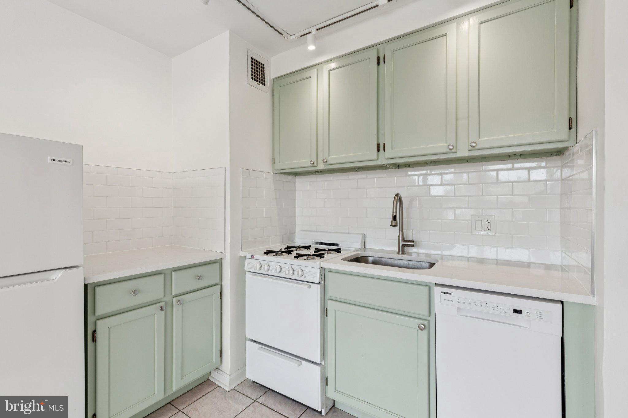 1810 Rittenhouse Square, Unit 406 Philadelphia, PA 19103 - Photo 8 of 17 Charming mint-green kitchen with modern flair.