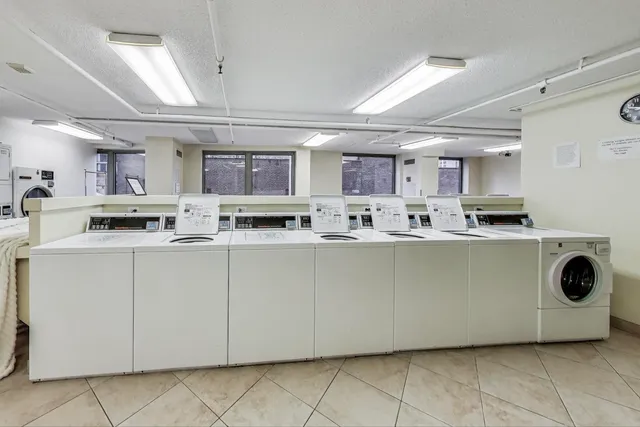 a kitchen with a cabinets and white appliances