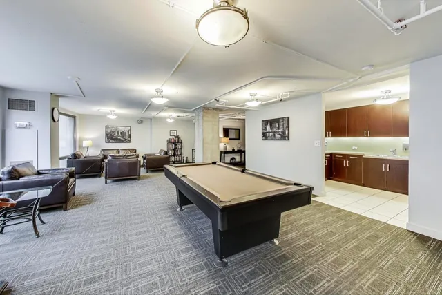 a dining room with furniture and wooden floor