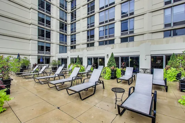 a picture of a bench in front of a house