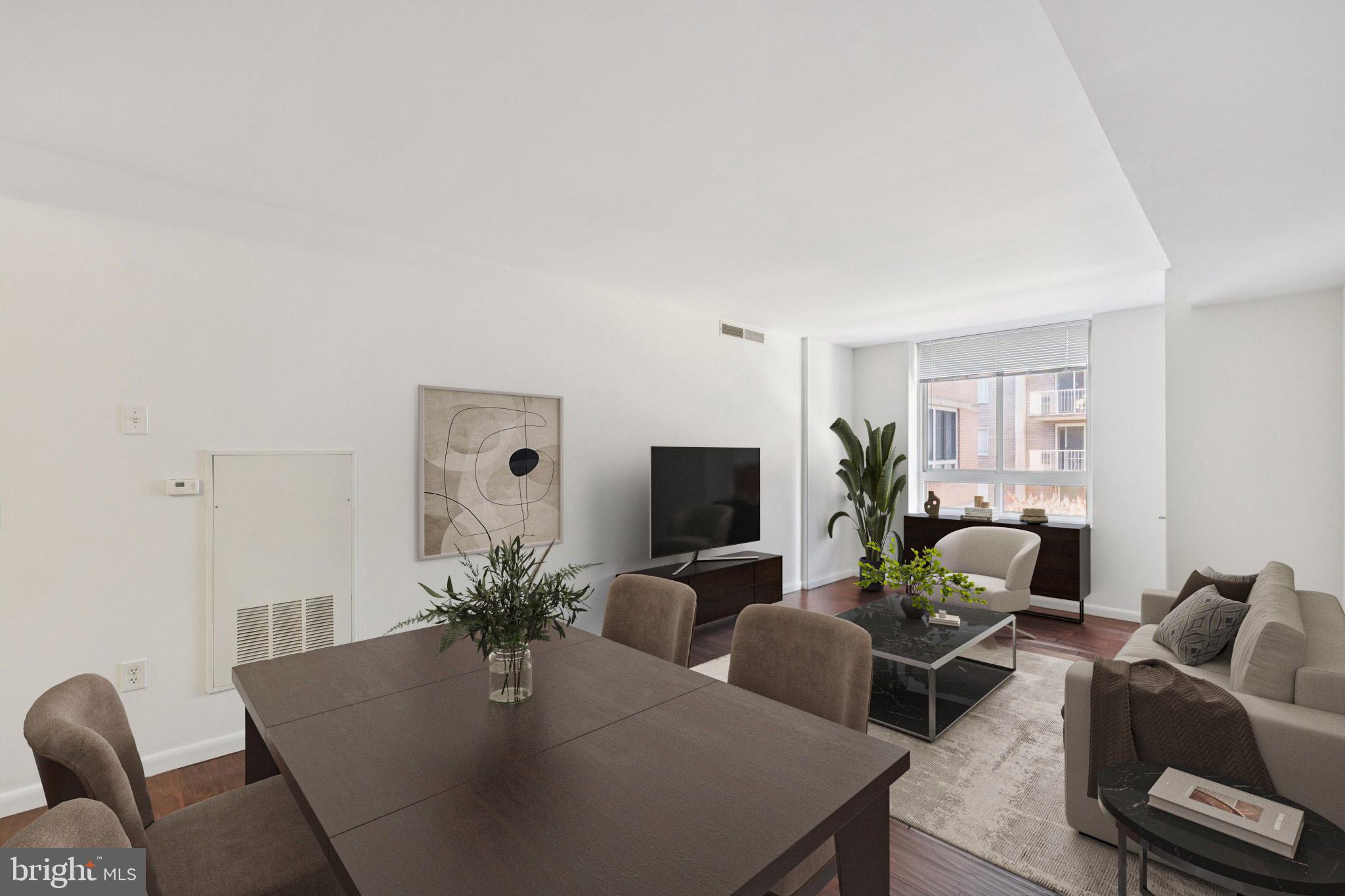 355 I Street Southwest, Unit 410 Washington, DC 20024 - Photo 12 of 31 a living room with furniture potted plant and a window