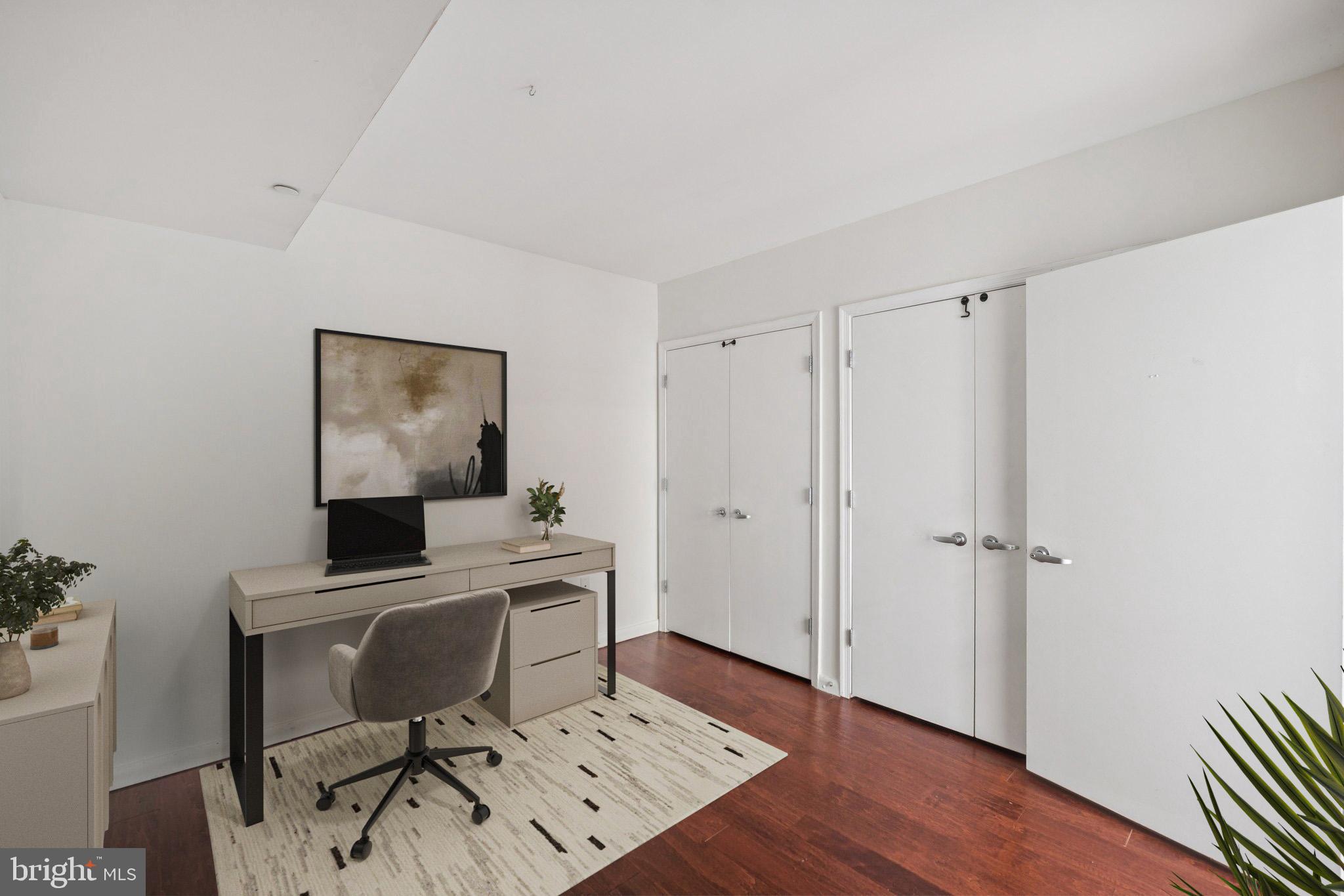 355 I Street Southwest, Unit 410 Washington, DC 20024 - Photo 20 of 31 a view of a workspace with furniture and wooden floor