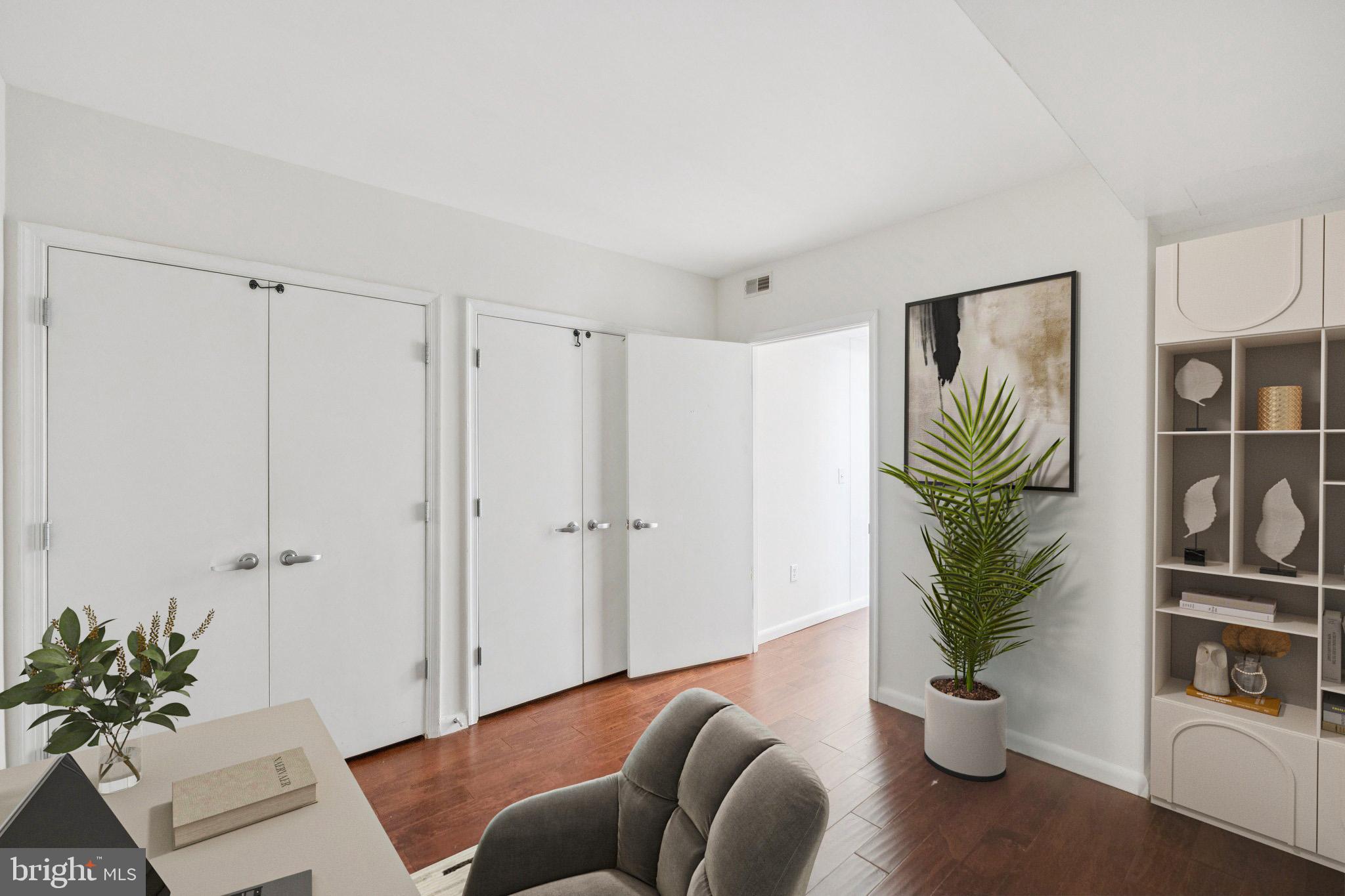 355 I Street Southwest, Unit 410 Washington, DC 20024 - Photo 22 of 31 a living room with furniture and a potted plant