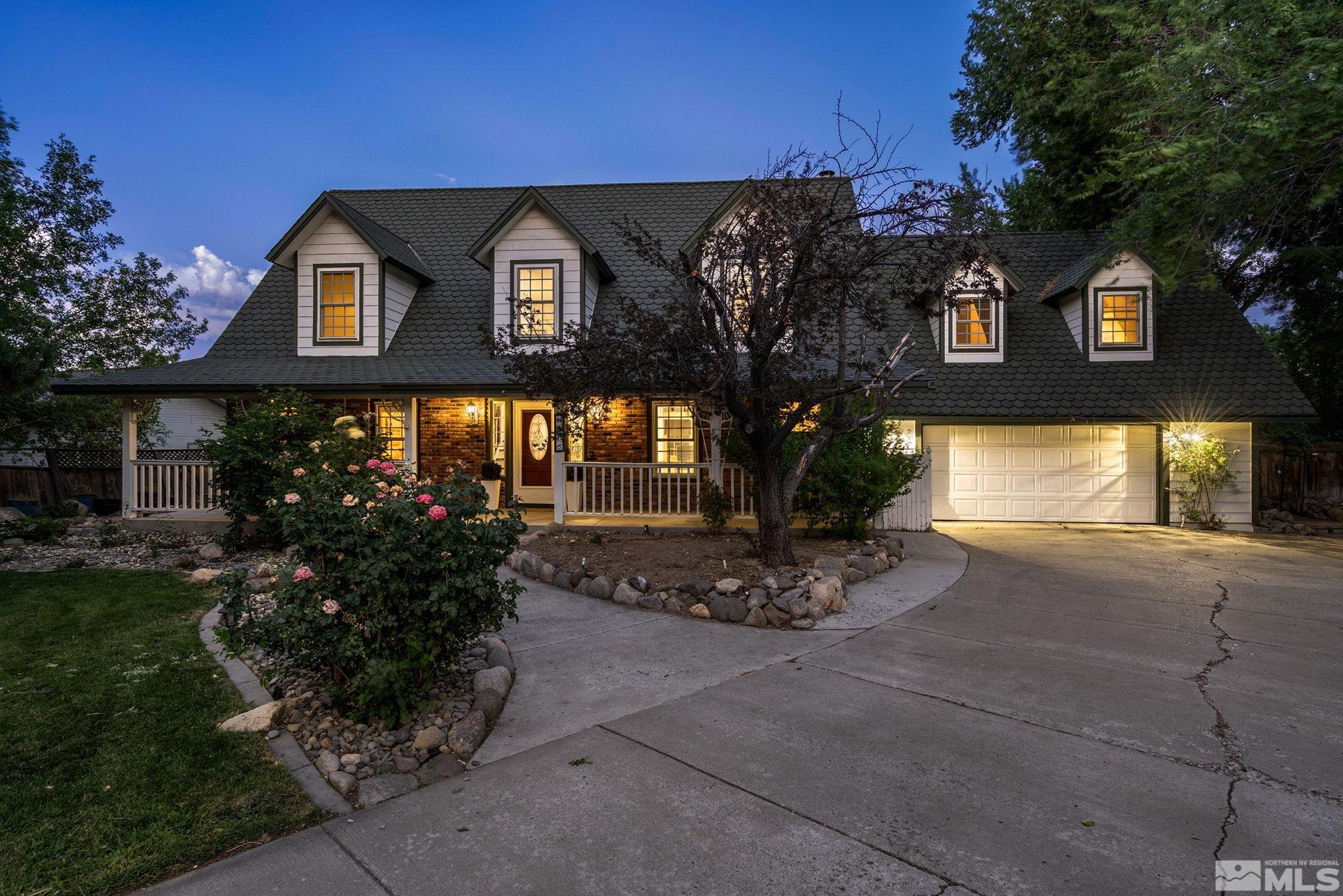10055 Raintree Court Reno, NV 89511 - Photo 1 of 39 a front view of a house with garden