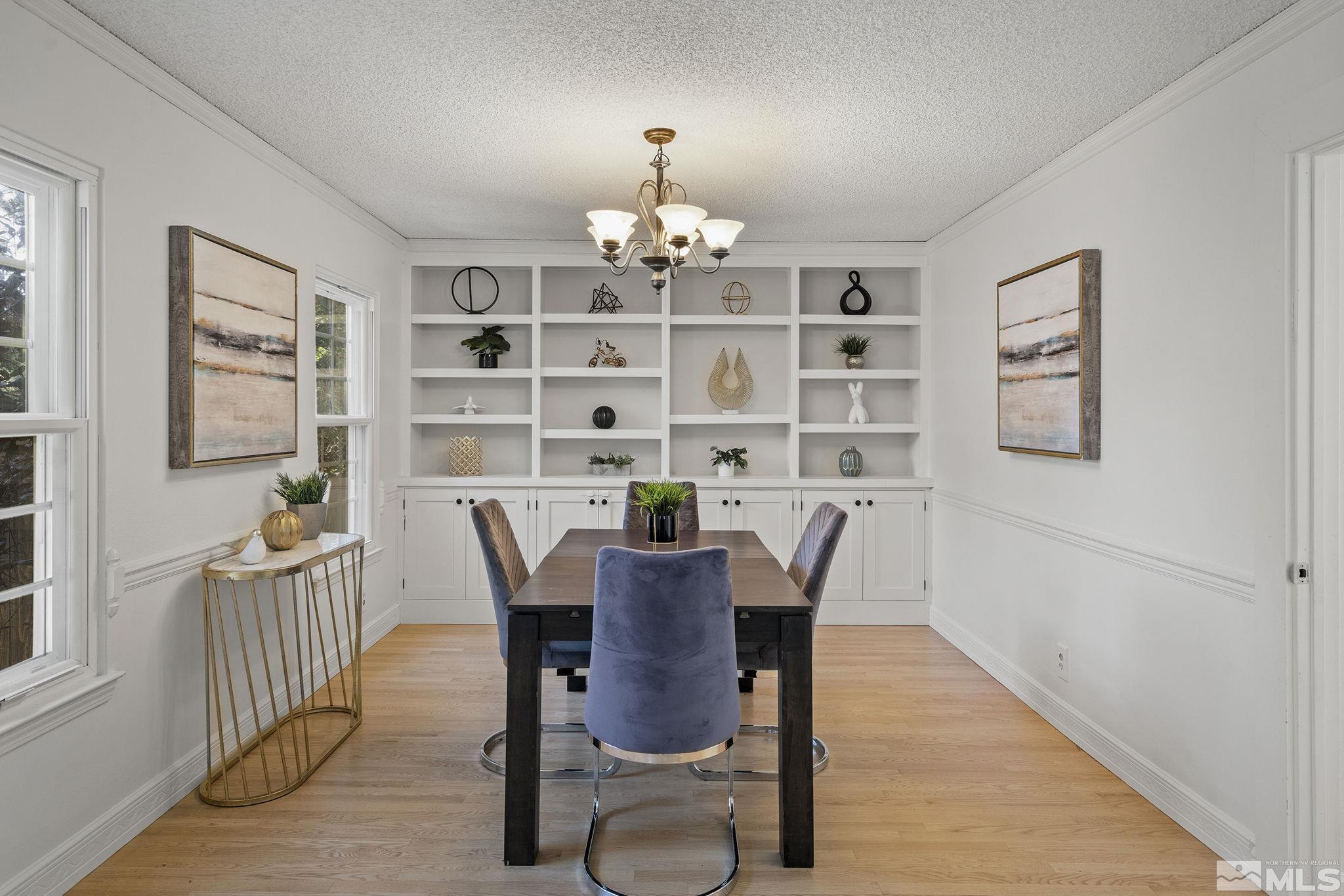 10055 Raintree Court Reno, NV 89511 - Photo 16 of 39 a view of a dining room with furniture a rug and wooden floor