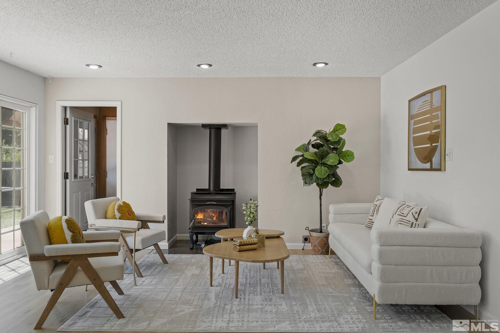 10055 Raintree Court Reno, NV 89511 - Photo 18 of 39 a living room with furniture and a potted plant