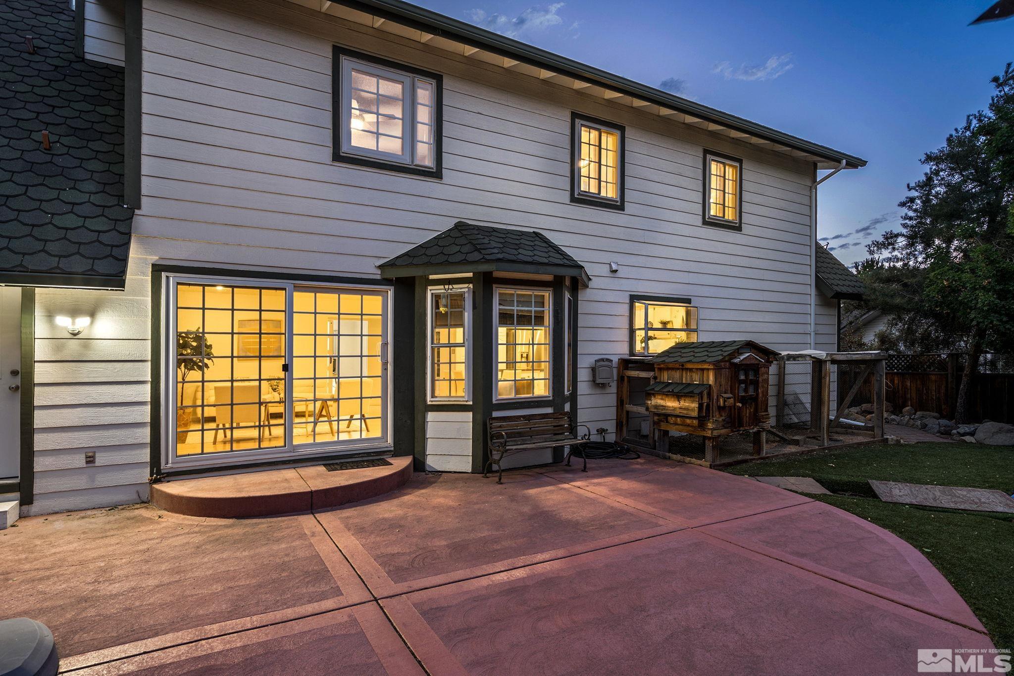 10055 Raintree Court Reno, NV 89511 - Photo 35 of 39 a front view of a house with barbeque and wooden fence