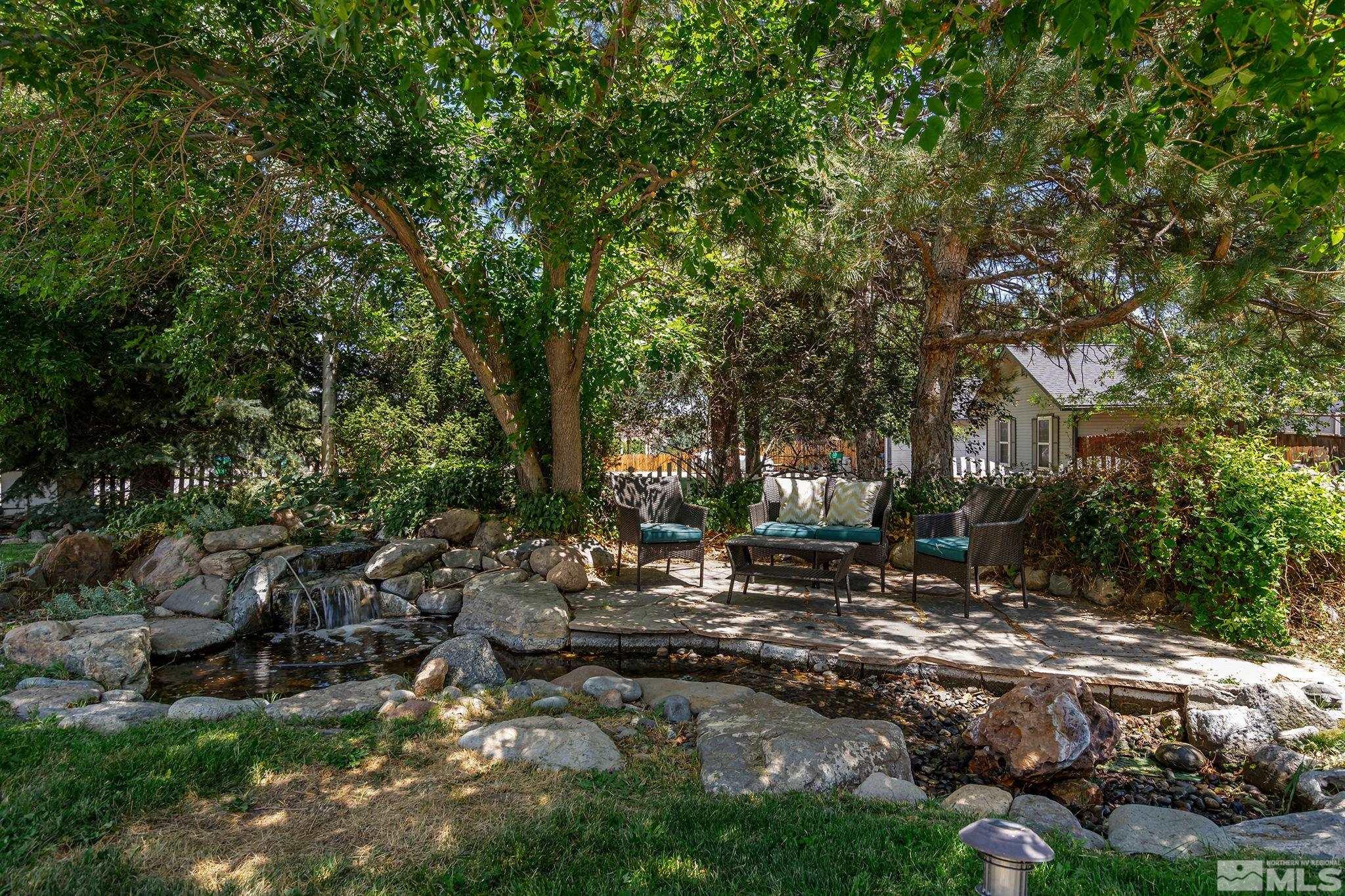 10055 Raintree Court Reno, NV 89511 - Photo 7 of 39 a backyard of a house with lots of green space