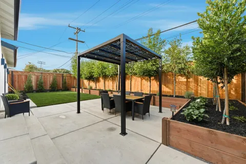 a patio view with a table and chairs