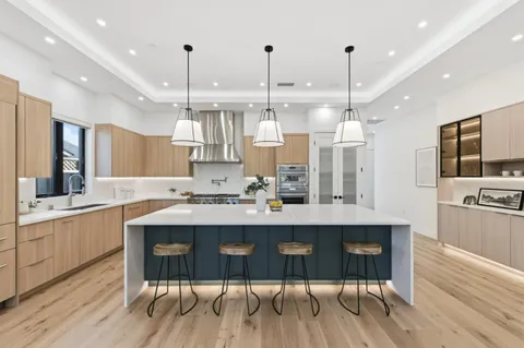 a kitchen with refrigerator and window