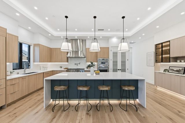 a kitchen with refrigerator and window