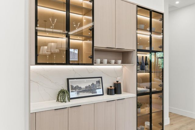 a bedroom with furniture and a large window