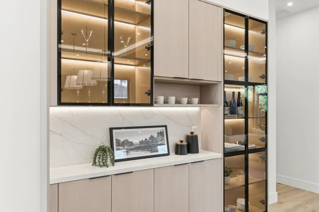 a bedroom with furniture and a large window