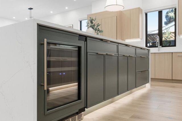 a view of a bedroom with furniture window and wooden floor