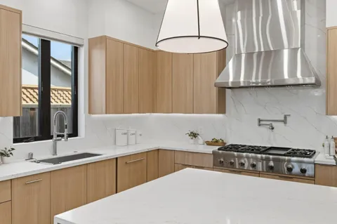a bathroom with a double vanity sink mirror and shower