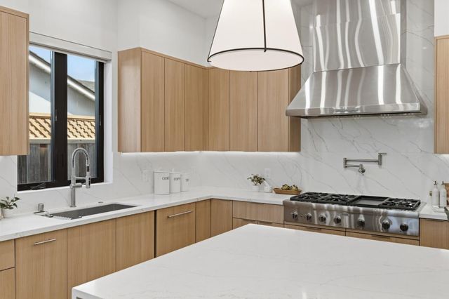a bathroom with a double vanity sink mirror and shower