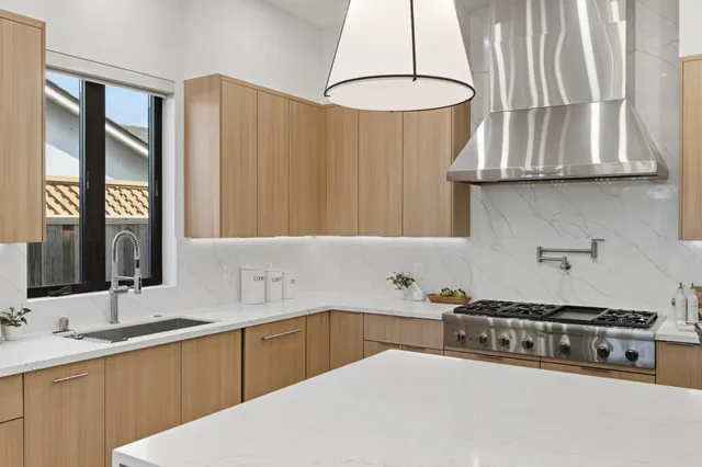 a bathroom with a double vanity sink mirror and shower