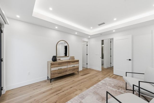 a bedroom with bed and a window