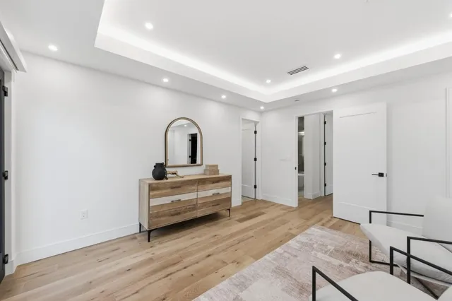 a bedroom with bed and a window