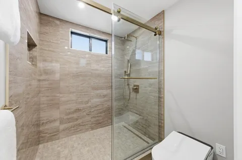 a bedroom with bed and furniture